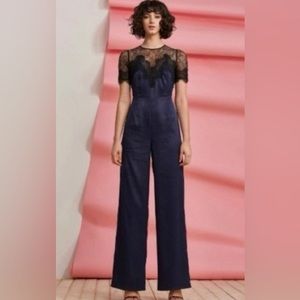 Foxiedox Anthropologie Navy blue jumpsuit with black lace Size XS NWT